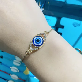 De Gelukkige Nieuwe Boze Oog Blue Eye Armband Voor Mannen, Vrouwen Koreaanse Mode Verstelbaar Kleur: Goud Metalen Ketting Charme Armband Sieraden Cadeau